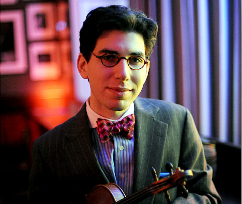 Aaron Weinstein poses with his violin